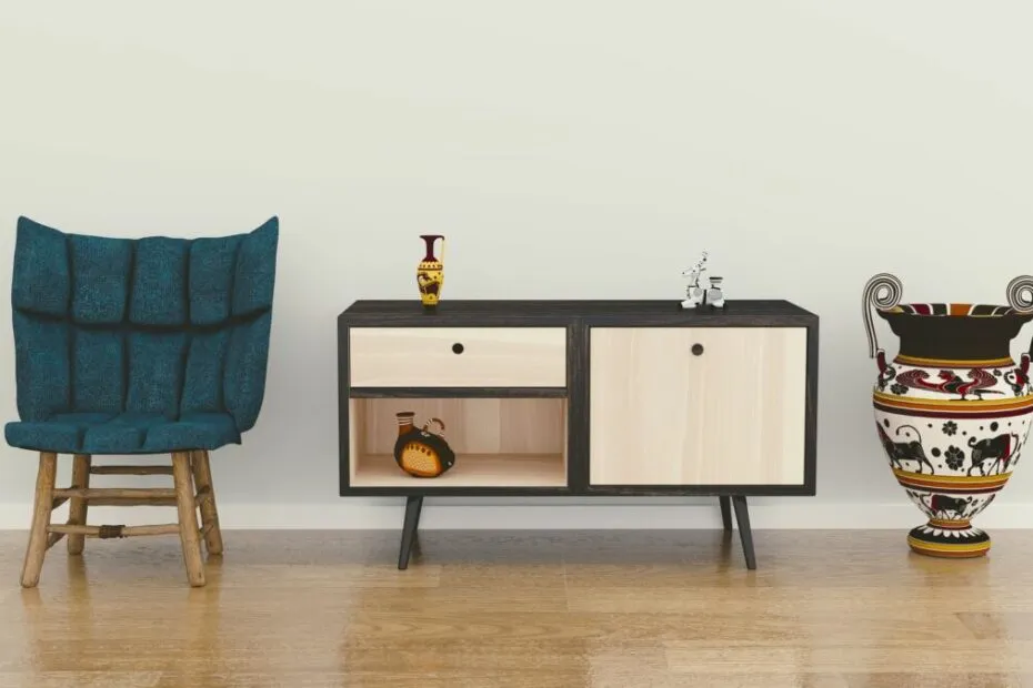 Poltrona blu, mobile moderno, vaso decorativo.